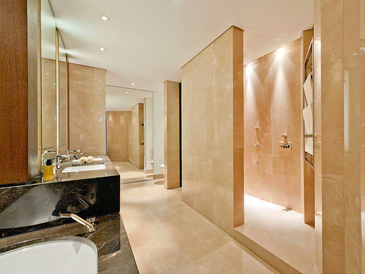 the-bathrooms-are-all-fitted-with-rich-cream-marble-his-and-hers-vanity-units-bathtubs-and-shower-rooms