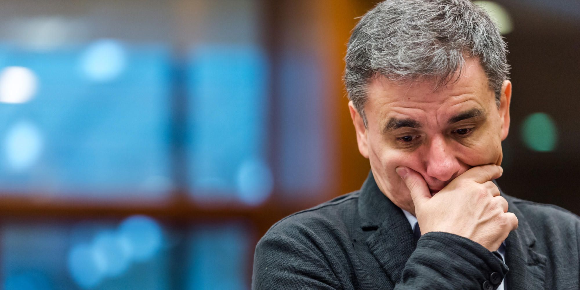 Greek Finance Minister Euclid Tsakalotos arrives for an EU finance ministers meeting at the EU Council building in Brussels on .
