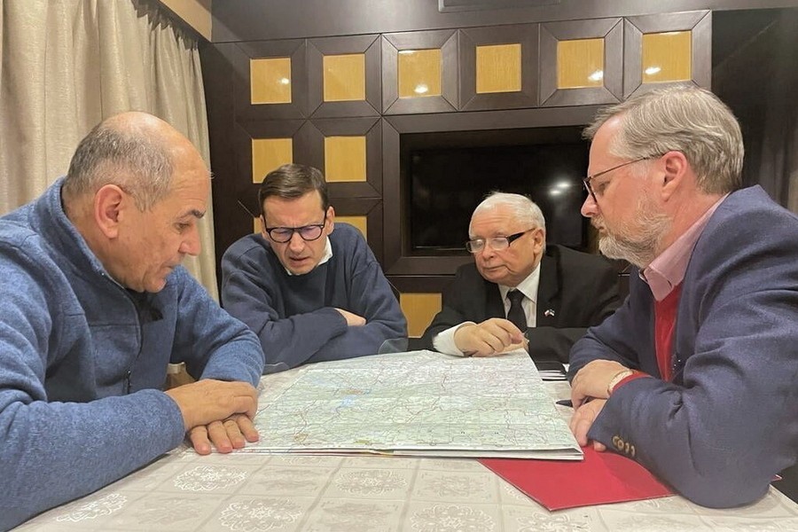 A handout photo made available via the Polish Prime Minister's twitter account shows (L-R) Slovenian Prime Minister Janez Jansa, Polish Prime Minister Mateusz Morawiecki, leader of the governing Law and Justice (PiS) party Jaroslaw Kaczynski, and Czech Prime Minister Petr Fiala talk over a map in a train to Kyiv, Ukraine, 15 March 2022. In Kyiv, Mateusz Morawiecki, Jaroslaw Kaczynski, and the Czech and Slovenian prime ministers Petr Fiala and Janez Jansa, will speak with President Zelensky and Prime Minister Denys Shmyhal on behalf of the European Council.