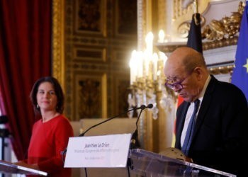 French Foreign Minister Jean-Yves Le Drian and German Foreign Minister Annalena Baerbock attend a joint news conference after a meeting at the Quai d'Orsay in Paris, France, December 9, 2021. REUTERS/Gonzalo Fuentes