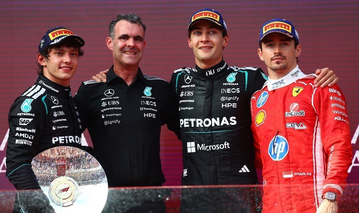 MELBOURNE, AUSTRALIA - MARCH 08: Race winner George Russell of Great Britain and Mercedes AMG Petronas F1 Team, Second placed Andrea Kimi Antonelli of Italy and Mercedes AMG Petronas F1 Team, Third placed Charles Leclerc of Monaco and Scuderia Ferrari, and Hywel Thomas, Managing director of Mercedes AMG High Performance Powertrains on the podium during the F1 Grand Prix of Australia at Albert Park Grand Prix Circuit on March 08, 2026 in Melbourne, Australia. (Photo by Joe Portlock/Getty Images)